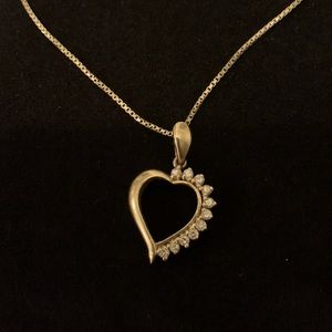 Gold heart pendant necklace with with 11 small cut diamonds